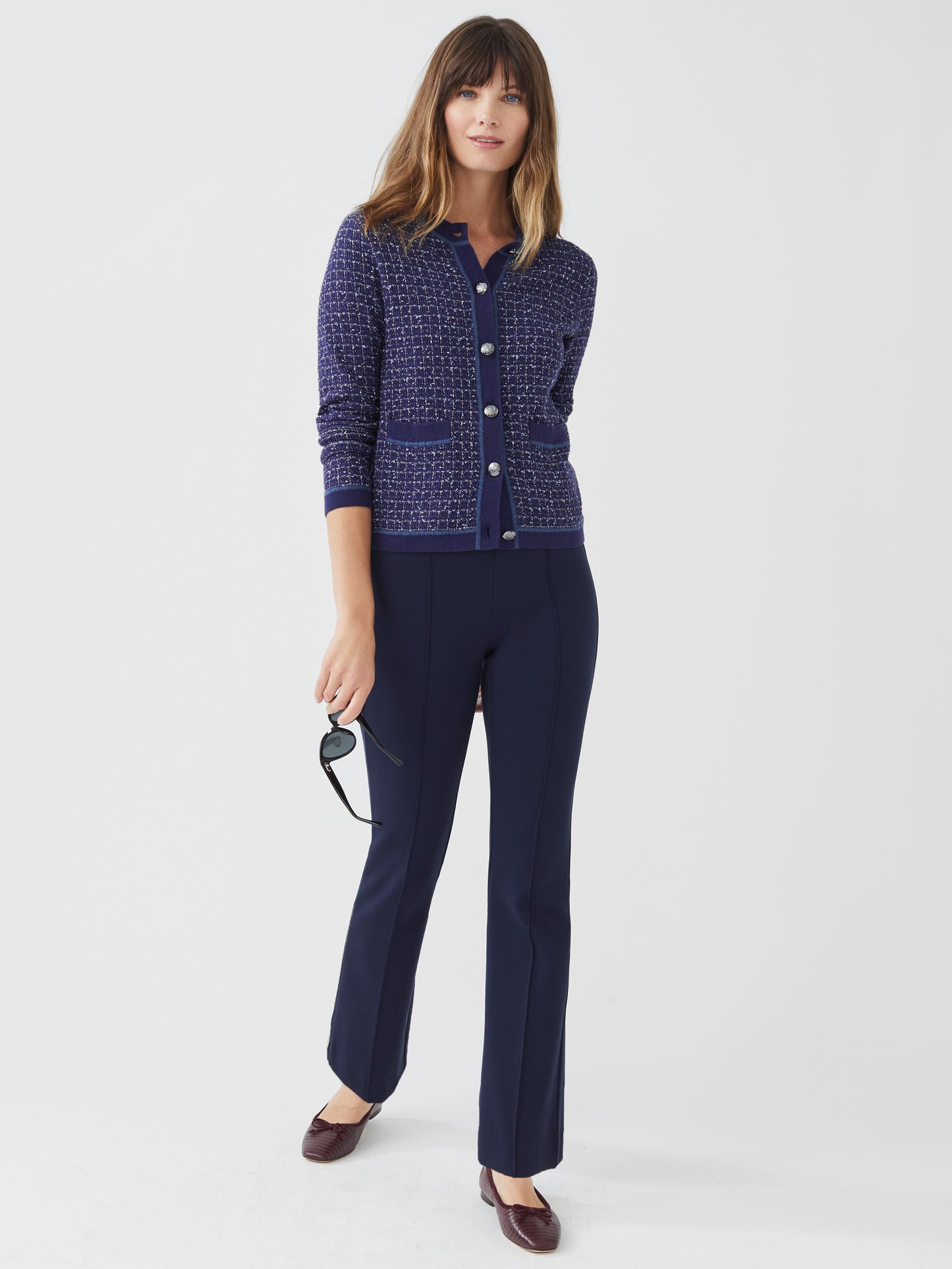 Model wearing J.McLaughlin Rylie pants in winter navy made with Bainbridge fabric.