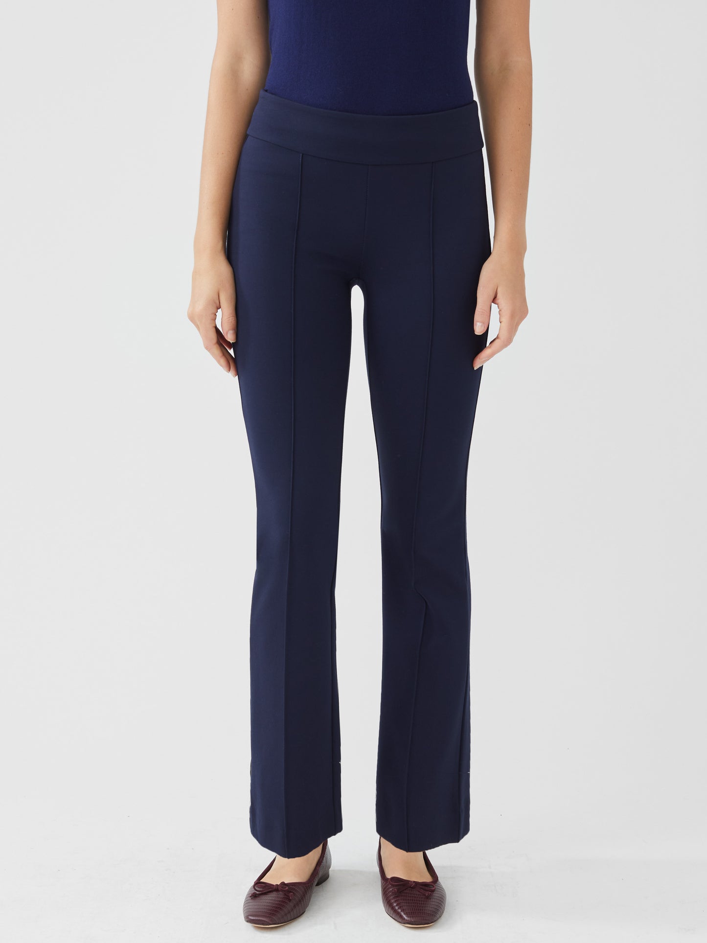 Model wearing J.McLaughlin Rylie pants in winter navy made with Bainbridge fabric.