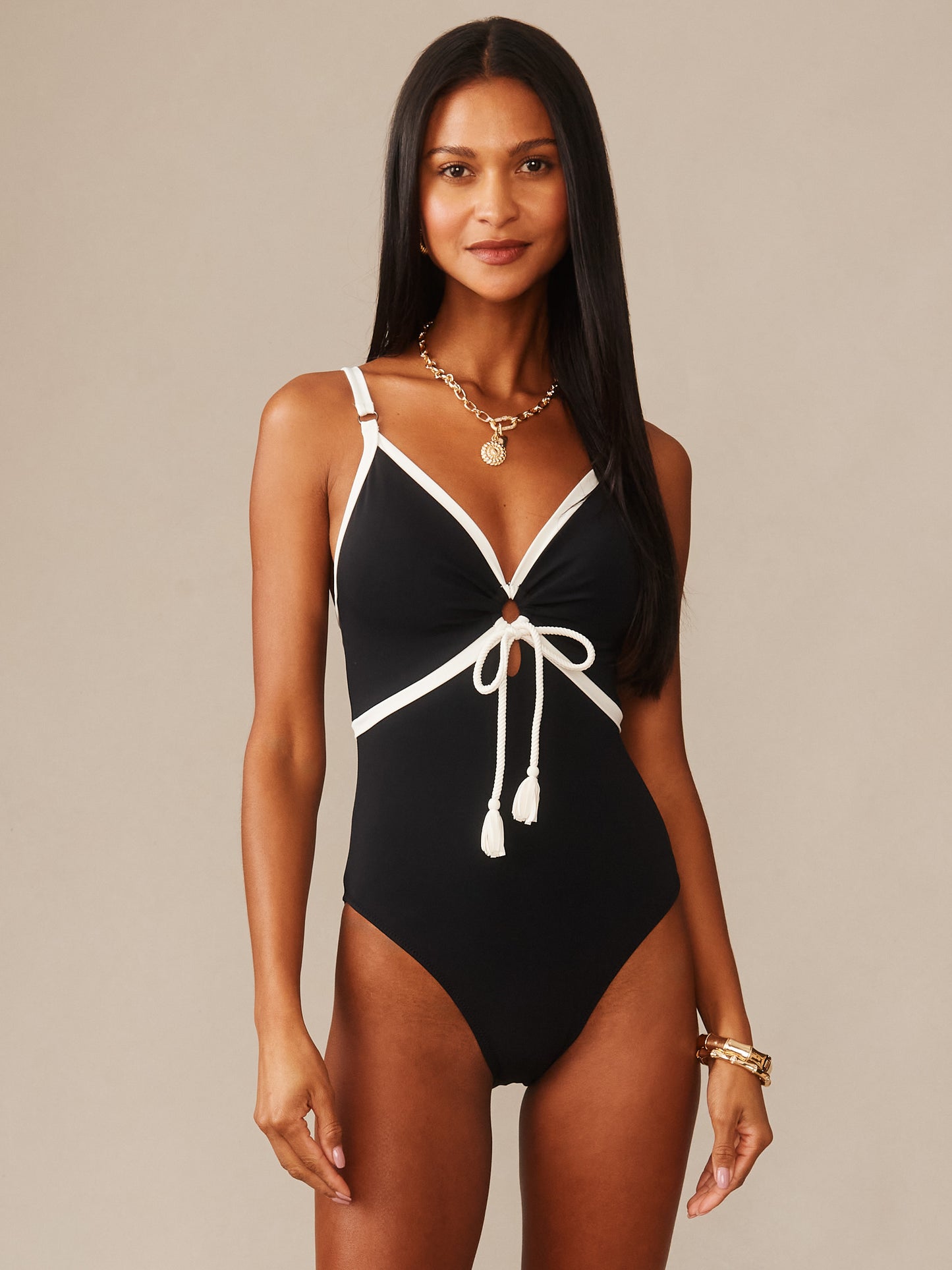 Woman wearing a black and white Sailor One Piece Swimsuit by J.McLaughlin, showcasing effortlessly stylish, enduring designs with a classic nautical-inspired look and refined craftsmanship.