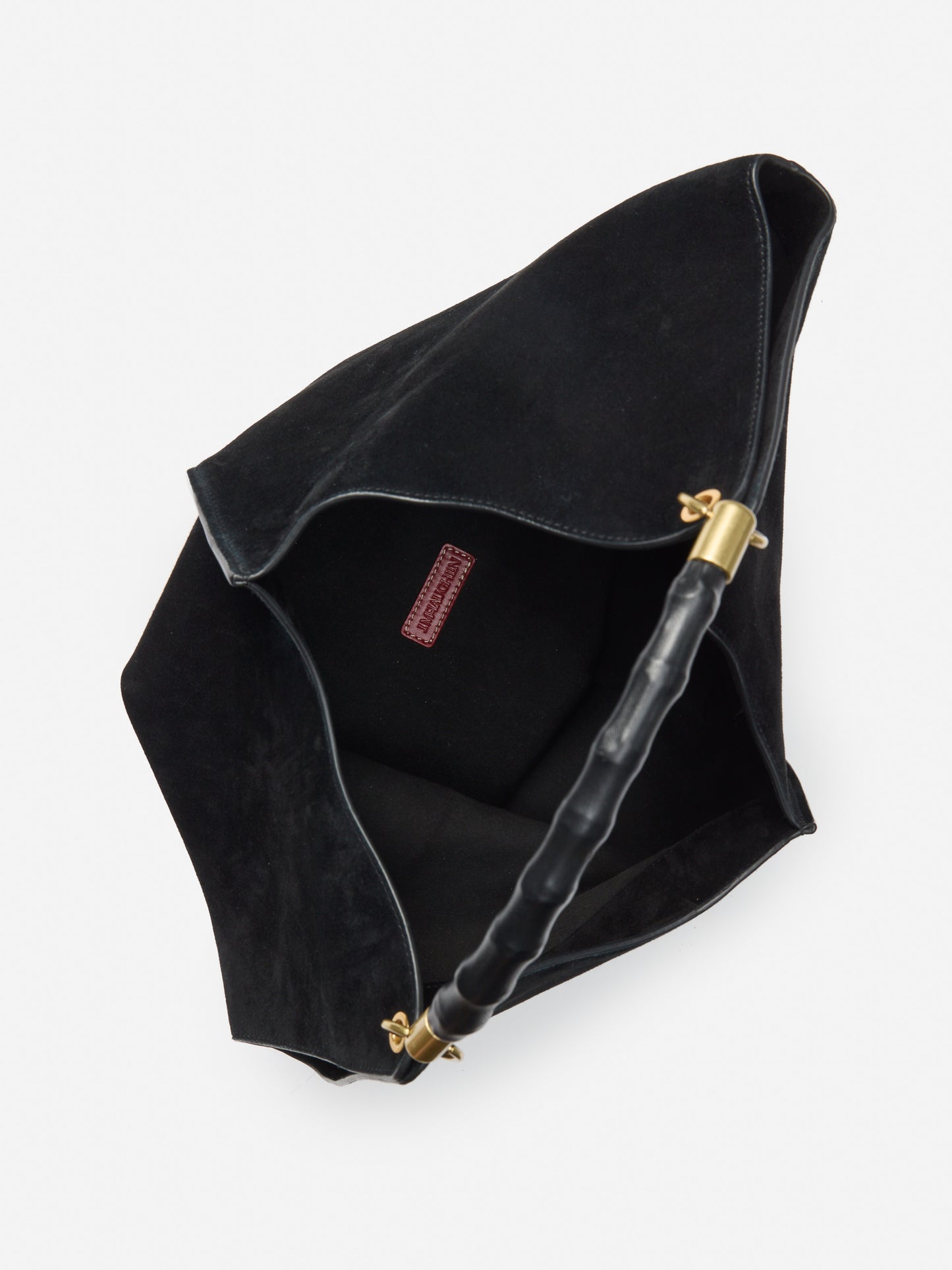 J.McLaughlin Sanne top handle handbag in black made with suede.