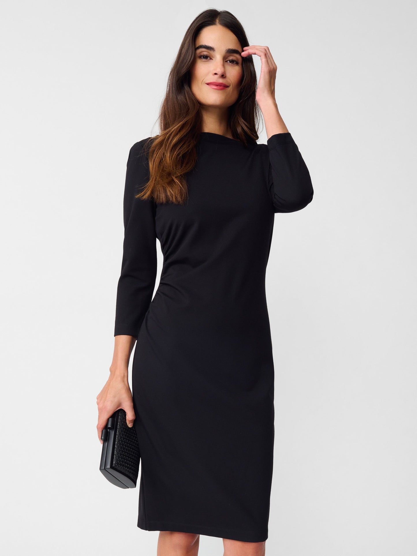 Model wearing J.McLaughlin Sarra dress in black made with refined bainbridge fabric.