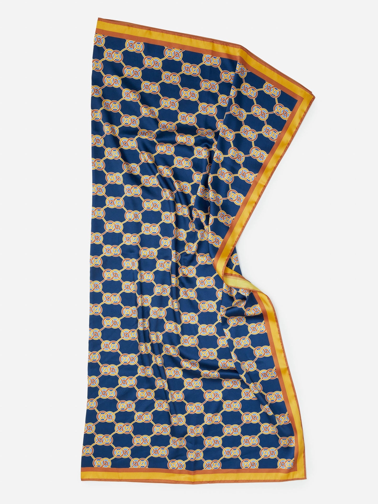 Gemma Scarf in Heraldic Knot by J.McLaughlin features an effortlessly stylish navy and gold pattern with enduring designs in innovative fabrics, embodying a legacy of timeless fashion. A destination for defining style. Life, Well-Lived.