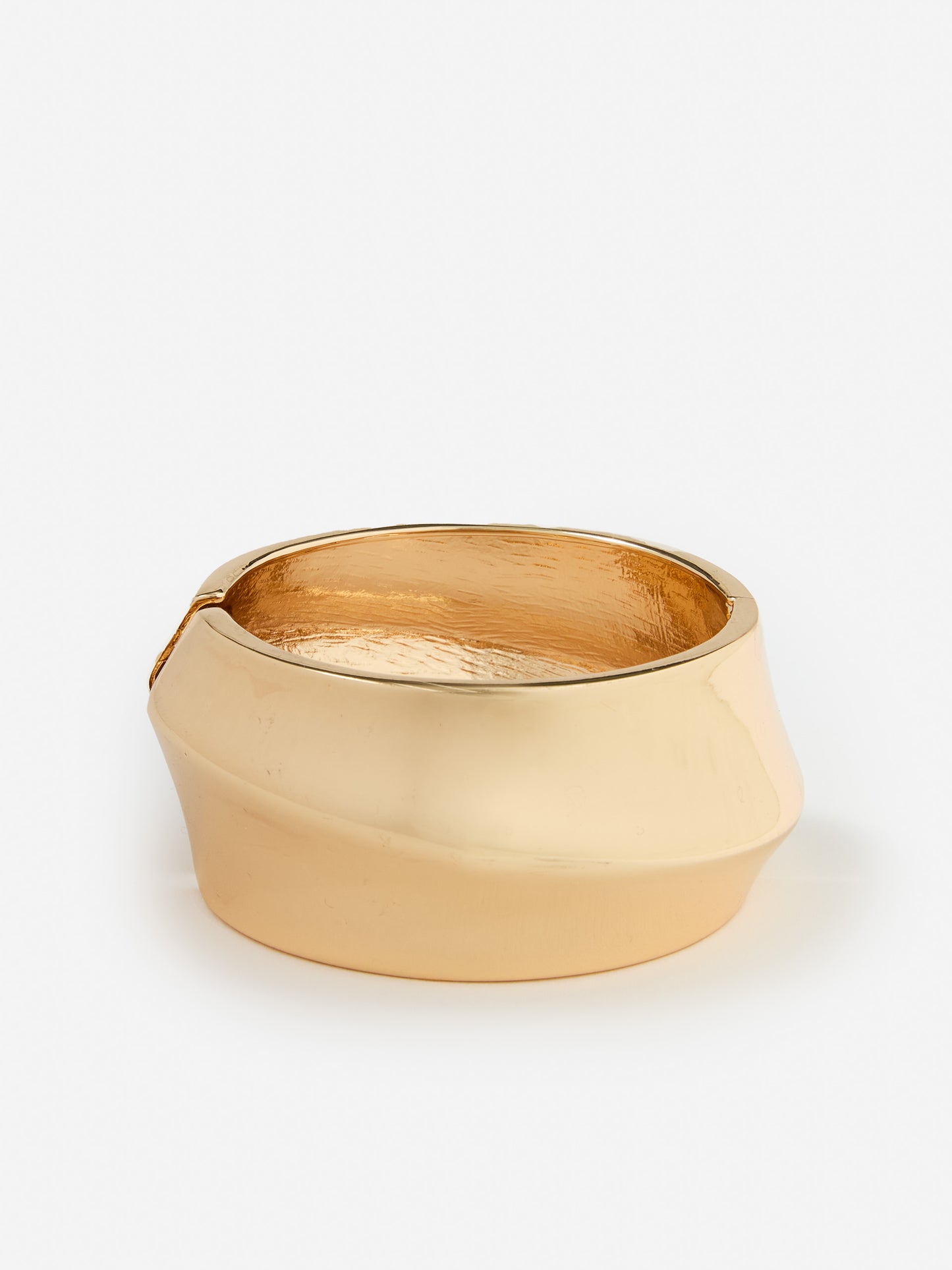 J.mcLaughlin sculptura; bangle in gold made with brass.