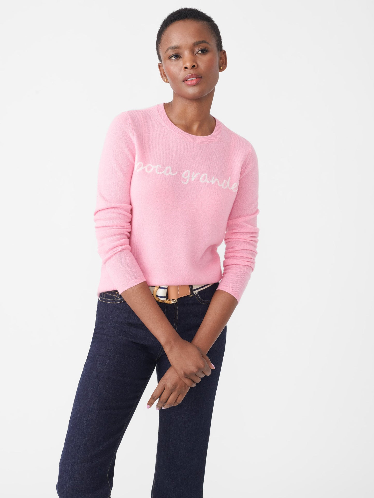 Model wearing J.McLaughlin Shield sweater in pink/white made with cashmere.