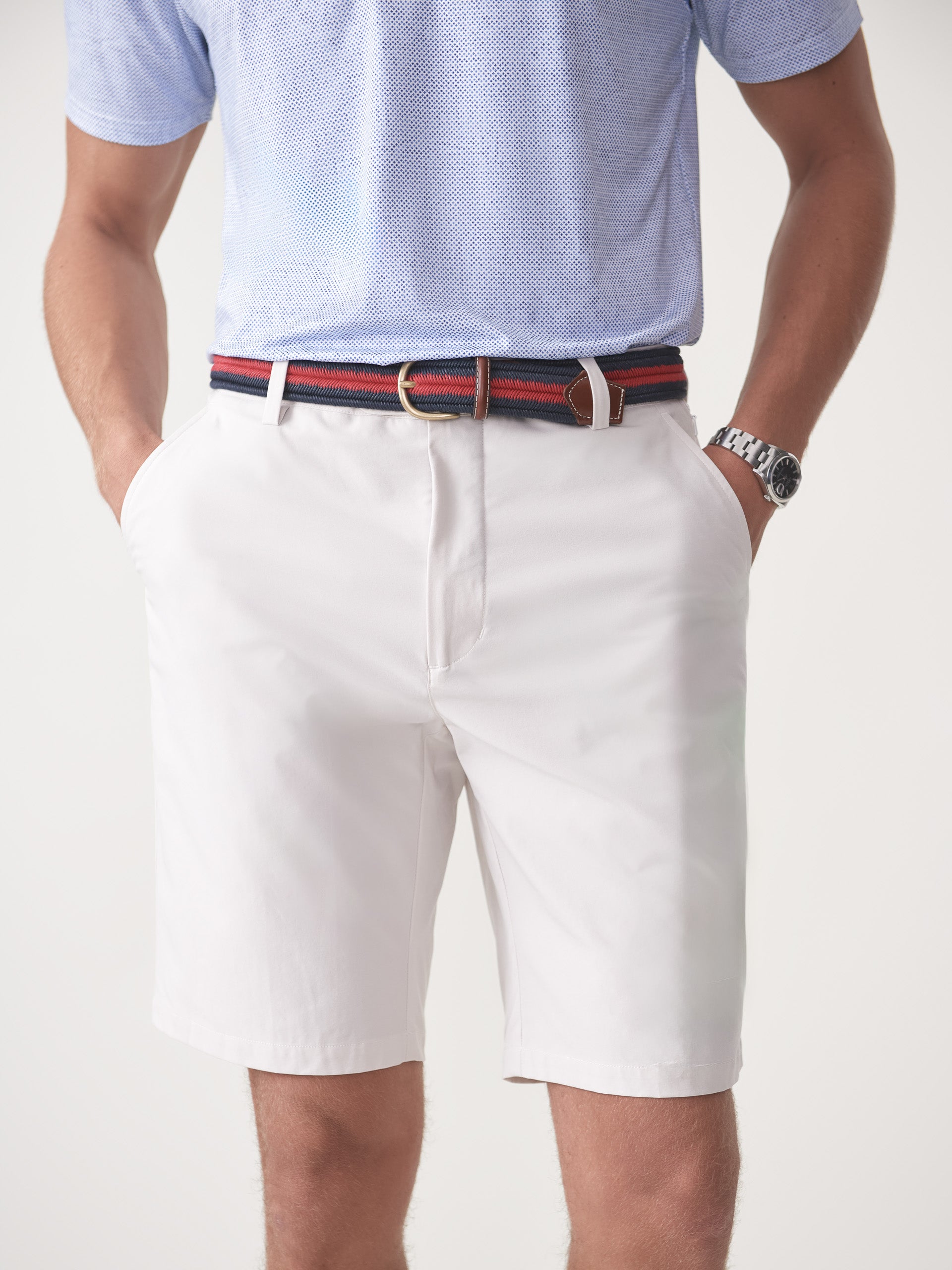 Model wearing J.McLaughlin Silas shorts in stone made with performance fabric.
