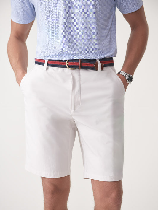 Model wearing J.McLaughlin Silas shorts in stone made with performance fabric.