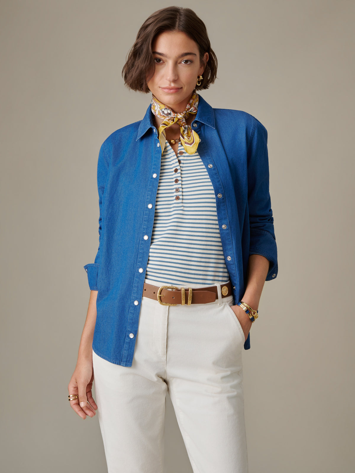 J.McLaughlin Lois Chambray Shirt in blue styled open over a striped top with white pants and a scarf for an effortlessly classic look
