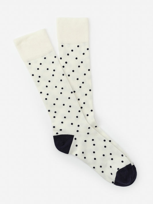 Socks in Polka Dots from J.McLaughlin featuring navy polka dots on a white background with navy heel and toe, combining effortlessly stylish design and enduring fabrics in a classic look.