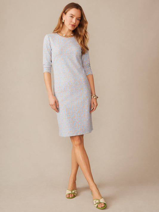 Woman wearing a light blue and brown patterned Sophia Dress in Bamboo Lane by J.McLaughlin, showcasing effortlessly stylish design with enduring appeal and innovative fabric in a timeless classic silhouette.