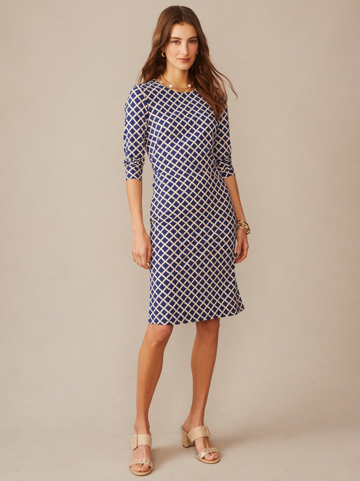 Woman wearing Sophia Dress in Micro Bamboo by J.McLaughlin in a navy and sand geometric pattern, effortlessly stylish with enduring design and innovative fabric, embodying a legacy of timeless fashion at a destination for defining style. Life, Well-Lived.