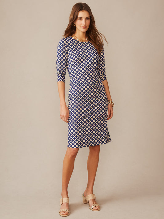 Woman wearing Sophia Dress in Micro Bamboo by J.McLaughlin in a navy and sand geometric pattern, effortlessly stylish with enduring design and innovative fabric, embodying a legacy of timeless fashion at a destination for defining style. Life, Well-Lived.