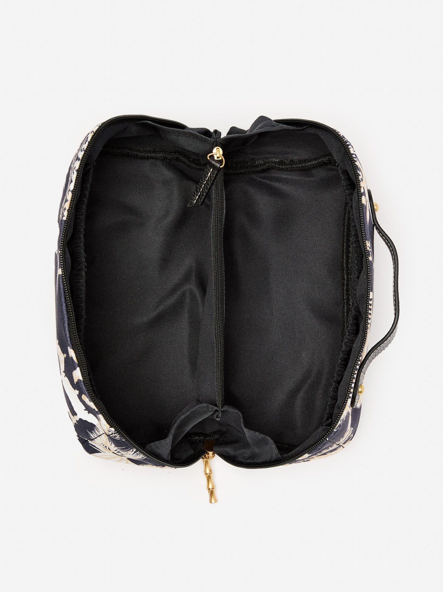 J.McLaughlin Stash bag in black/sand made with nylon.