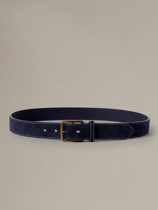 Suede Belt in navy suede with a brass buckle by J.McLaughlin displayed flat for timeless everyday style