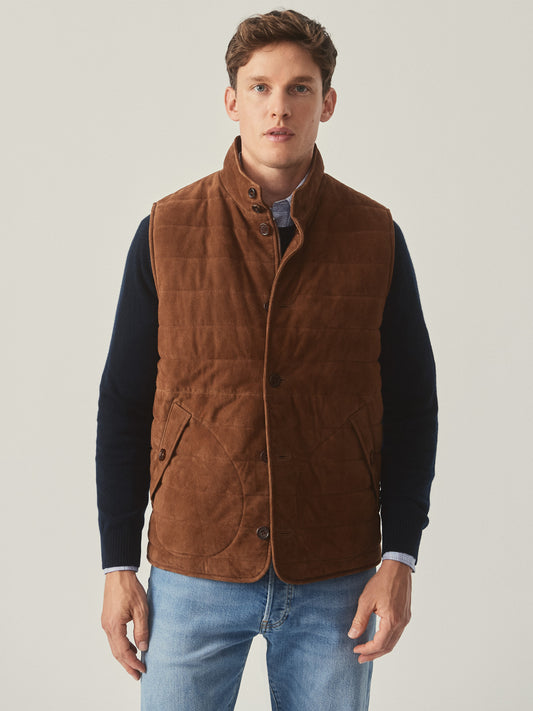 Model wearing J.McLaughlin Gillet in whiskey made with suede.