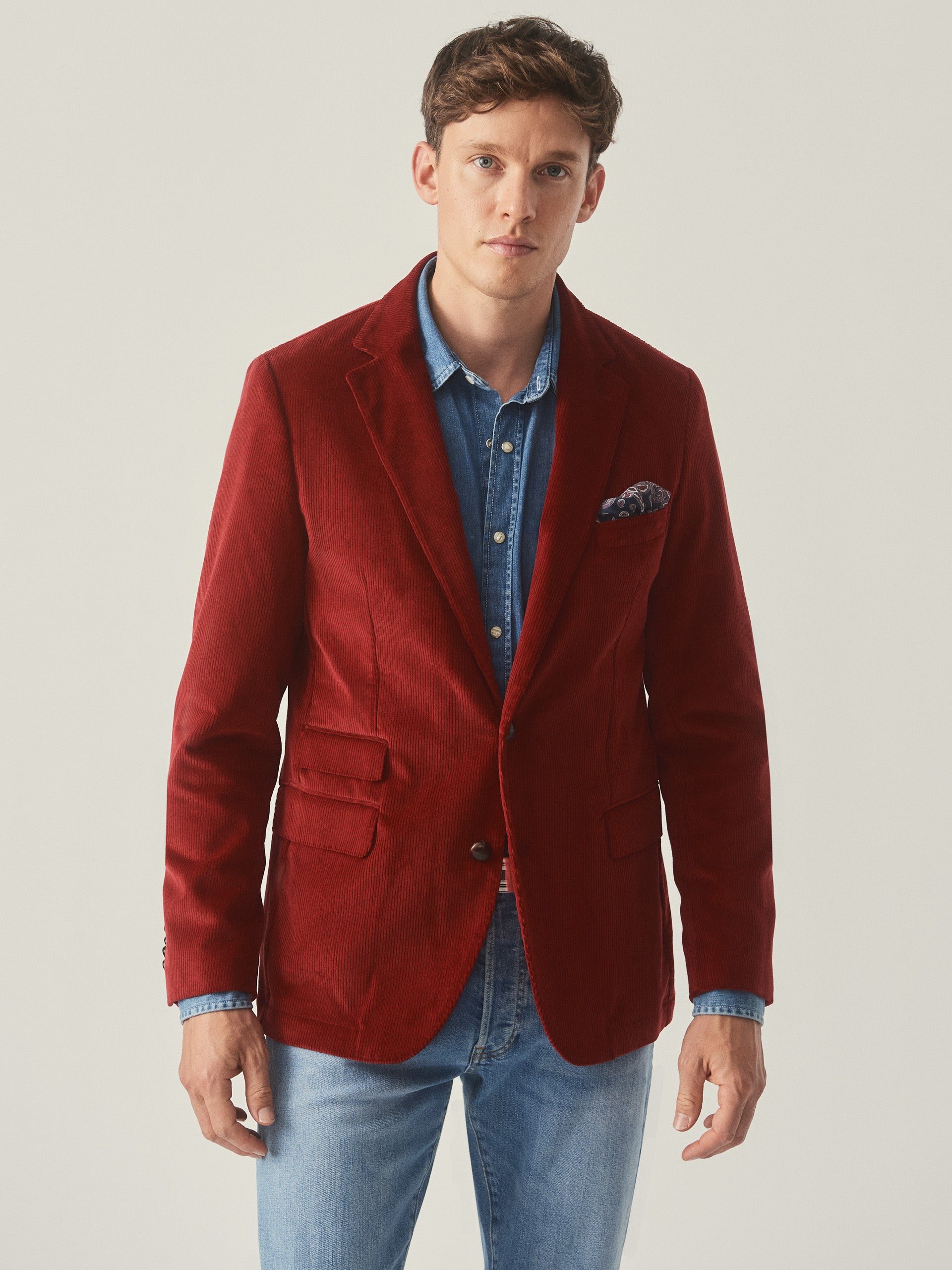 Model wearing J.McLaughlin Suffolk blazer in berry made with cotton corduroy.