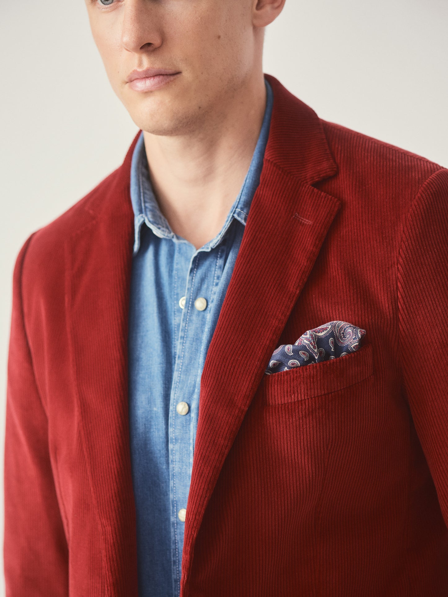 Model wearing J.McLaughlin Suffolk blazer in berry made with cotton corduroy.