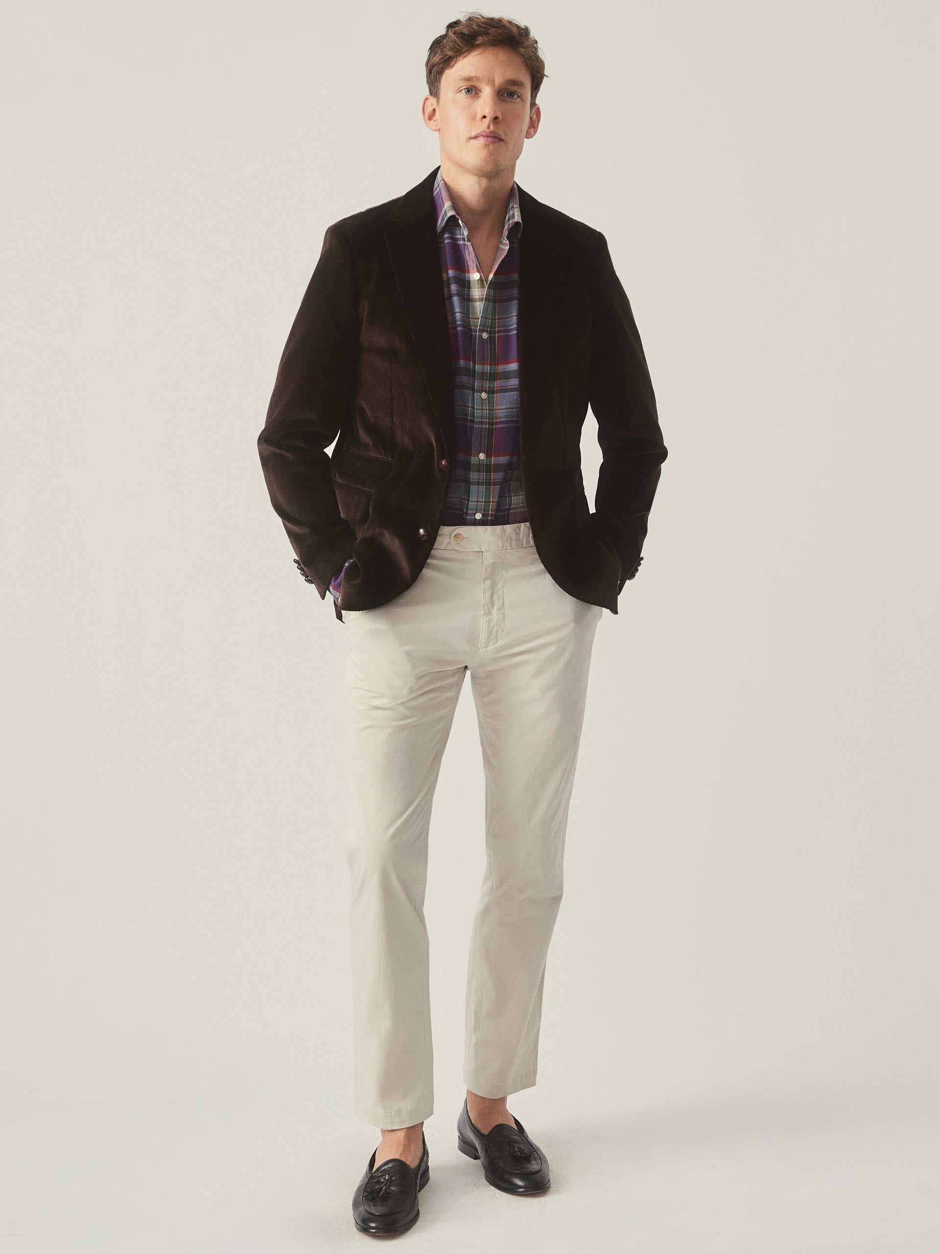 Model wearing J.McLaughlin Suffolk blazer in brown made with cotton corduroy.