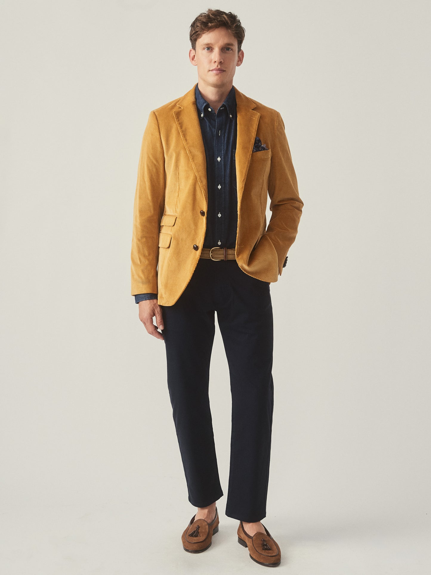 Model wearing J.McLaughlin Suffolk blazer in corn made with cotton corduroy.