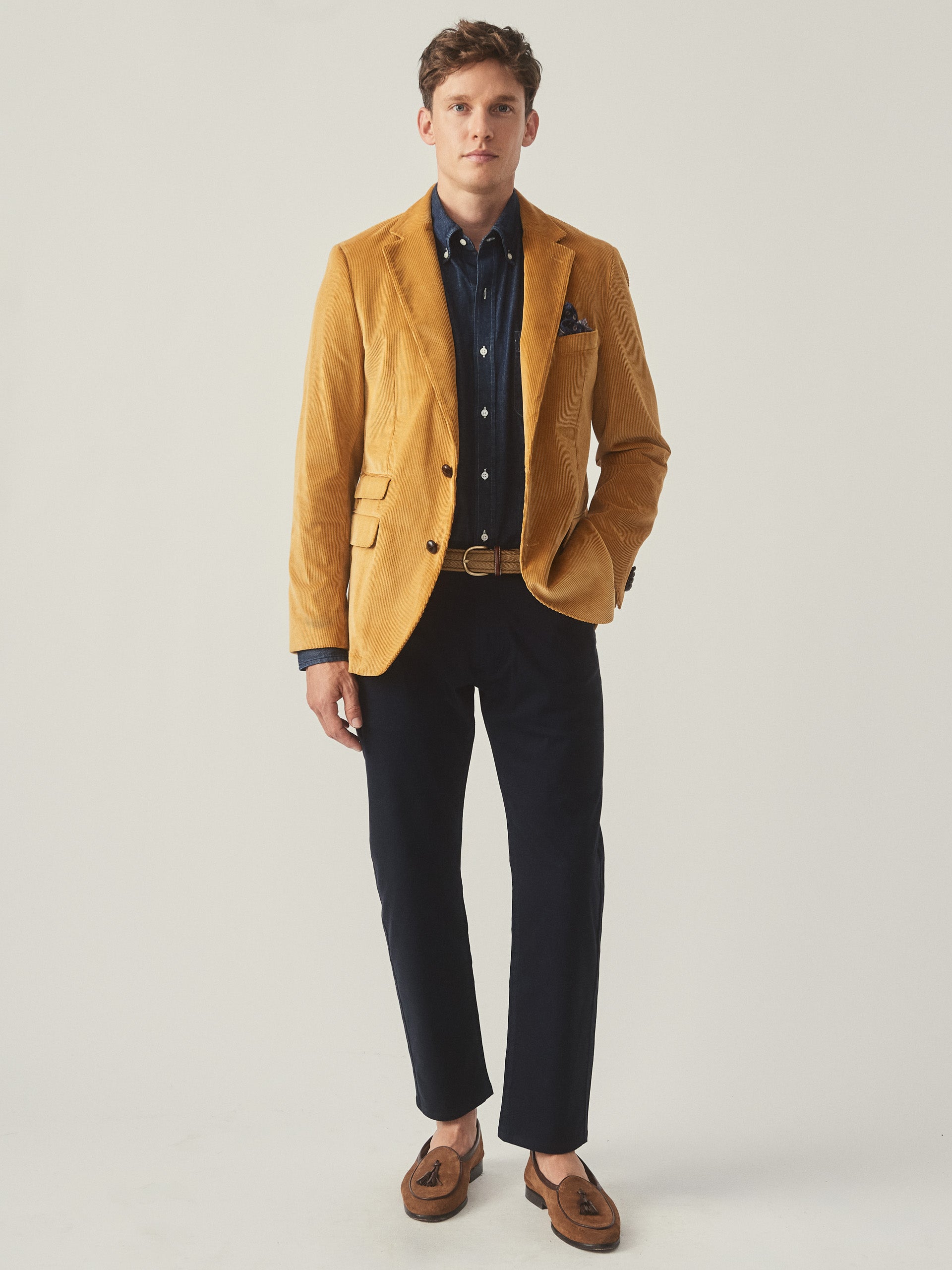 Model wearing J.McLaughlin Suffolk blazer in corn made with cotton corduroy.