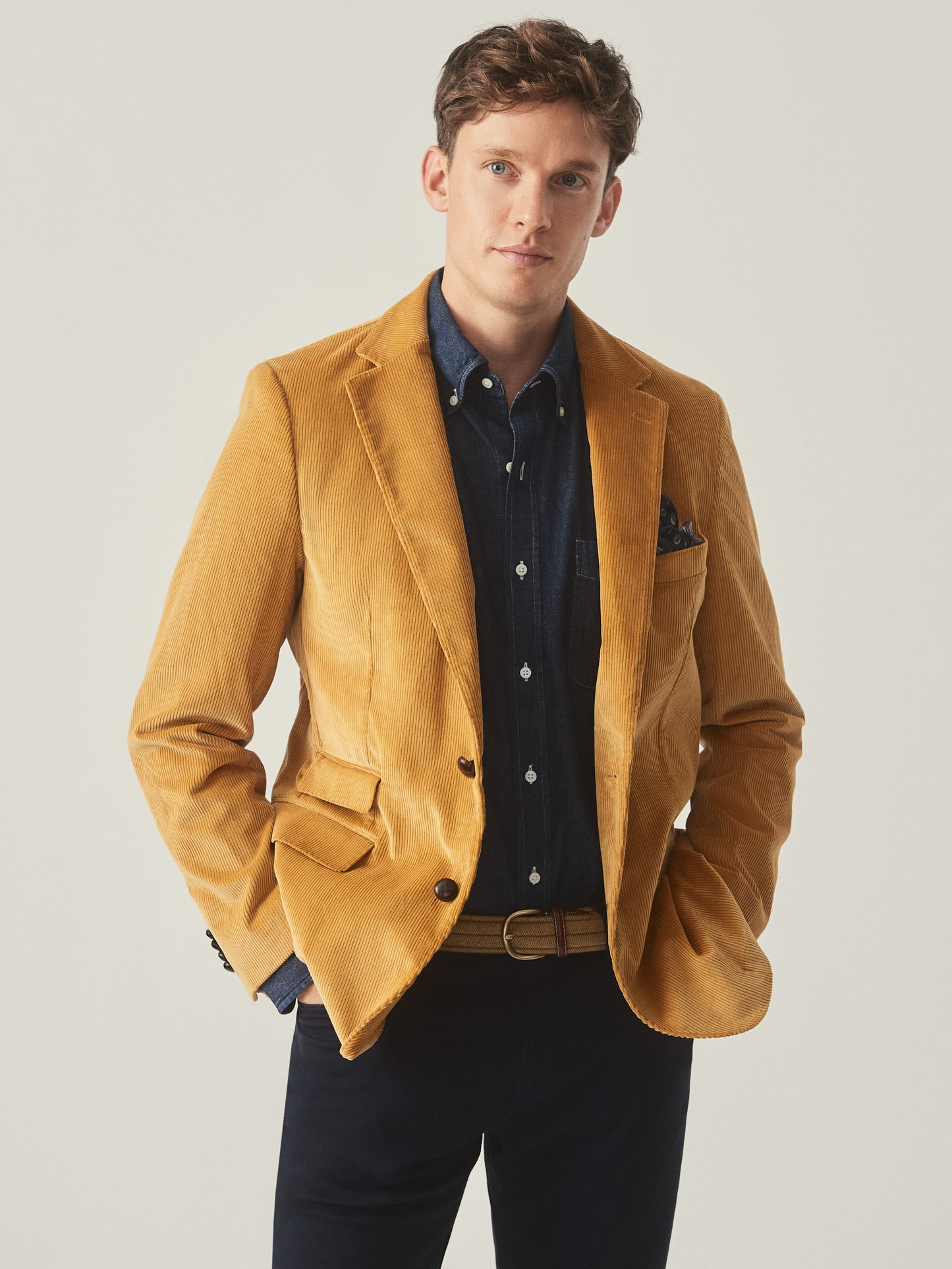 Model wearing J.McLaughlin Suffolk blazer in corn made with cotton corduroy.