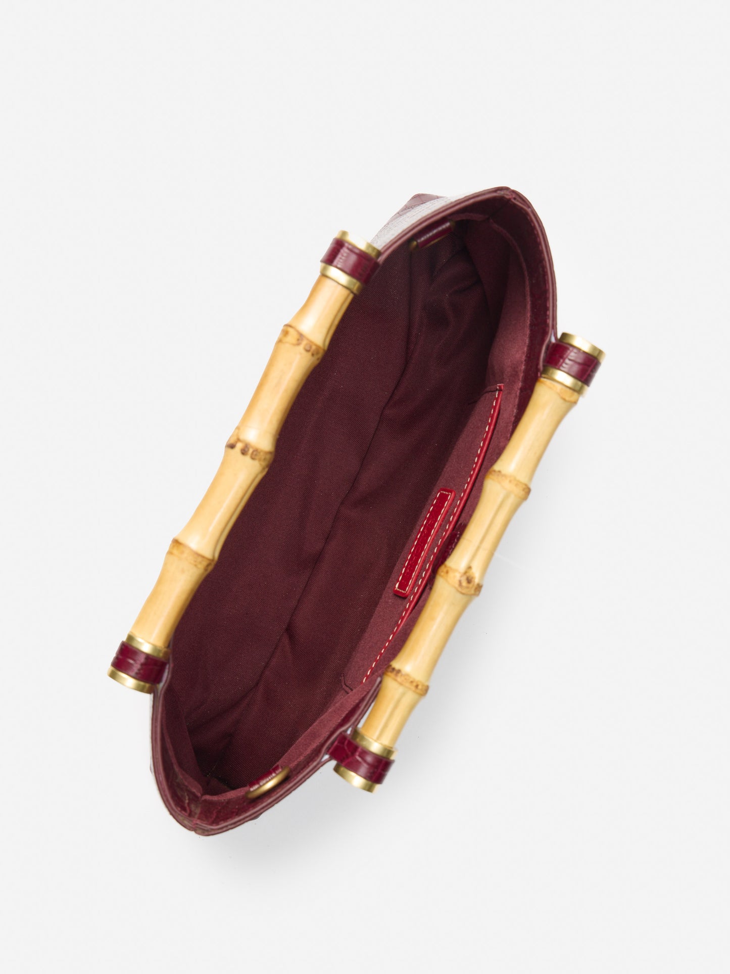 J.McLaughlin Sumpter clutch in burgundy made with leather.