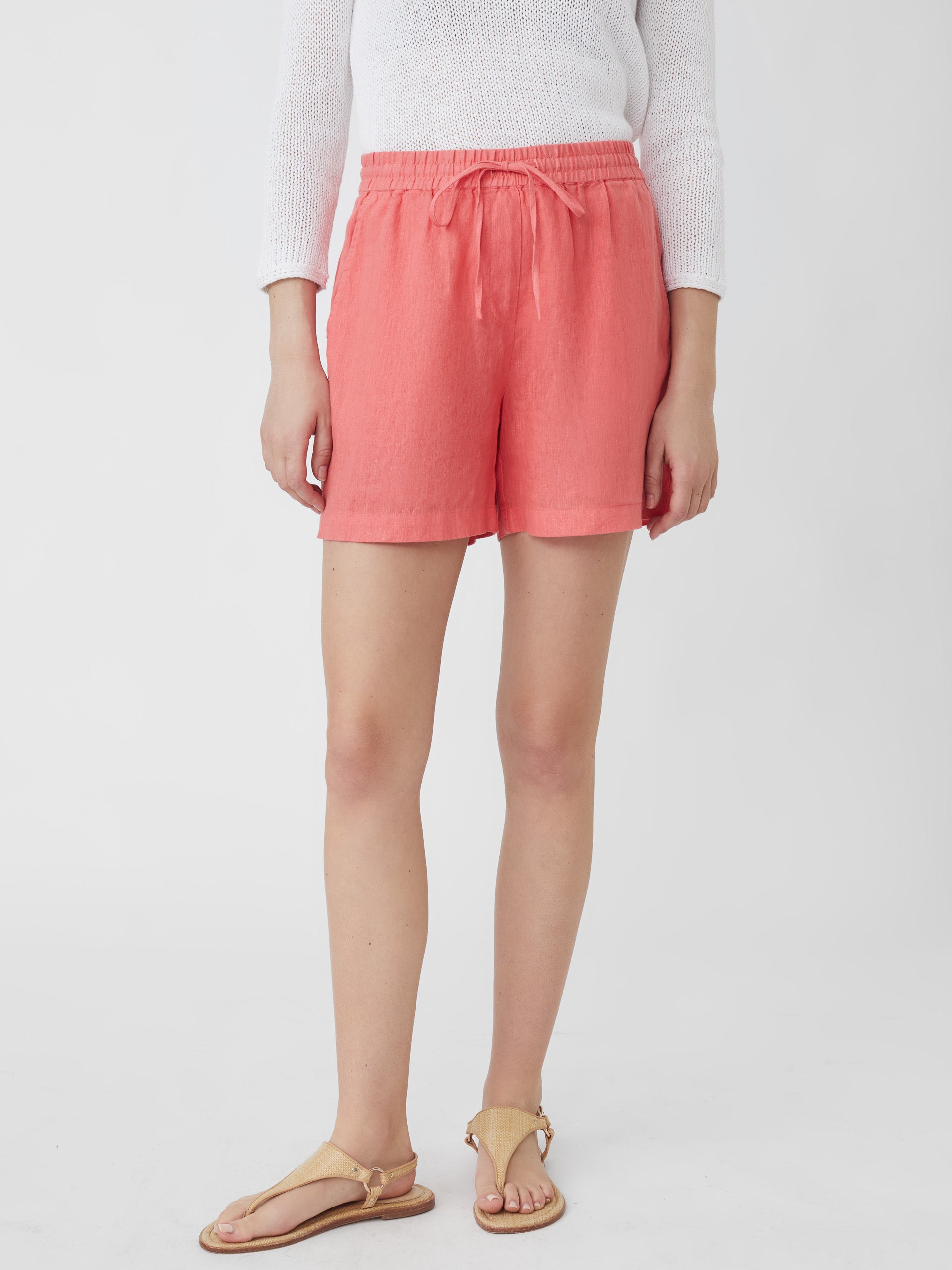 J.McLaughlin model wears Surya Linen Shorts in Apricot made with Linen.