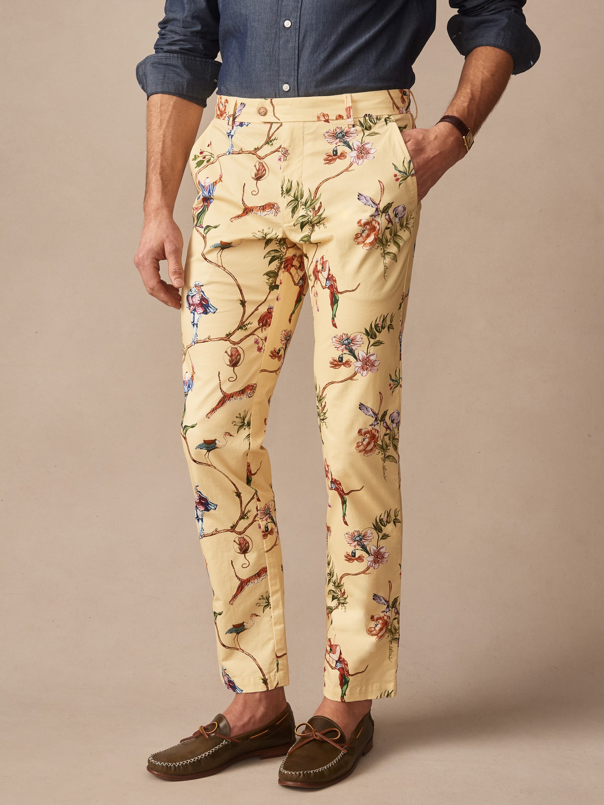 Man wearing Madison Fancy Pants in Garden Spectacle by J.McLaughlin, featuring an effortlessly stylish floral and figural print on light fabric, exemplifying enduring designs and innovative fabrics from a legacy of timeless fashion at a destination for defining style. Life, Well-Lived.