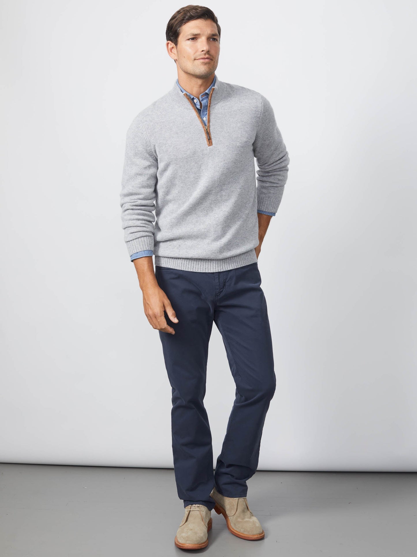 Model wearing J.McLaughlin Tate sweater in light gray made with cashmere.