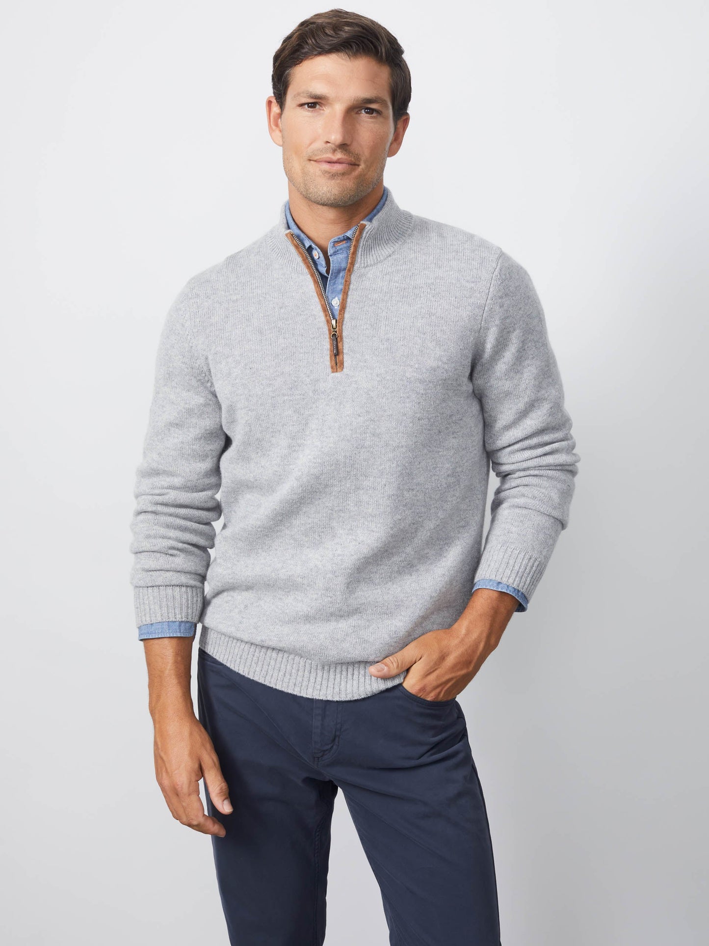 Model wearing J.McLaughlin Tate sweater in light gray made with cashmere.