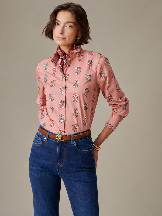 Woman wearing a Tess Ruffle Collar Shirt in Heritage Bloom by J.McLaughlin, styled with blue jeans and a brown belt, showcasing timeless, classic clothing with enduring style.
