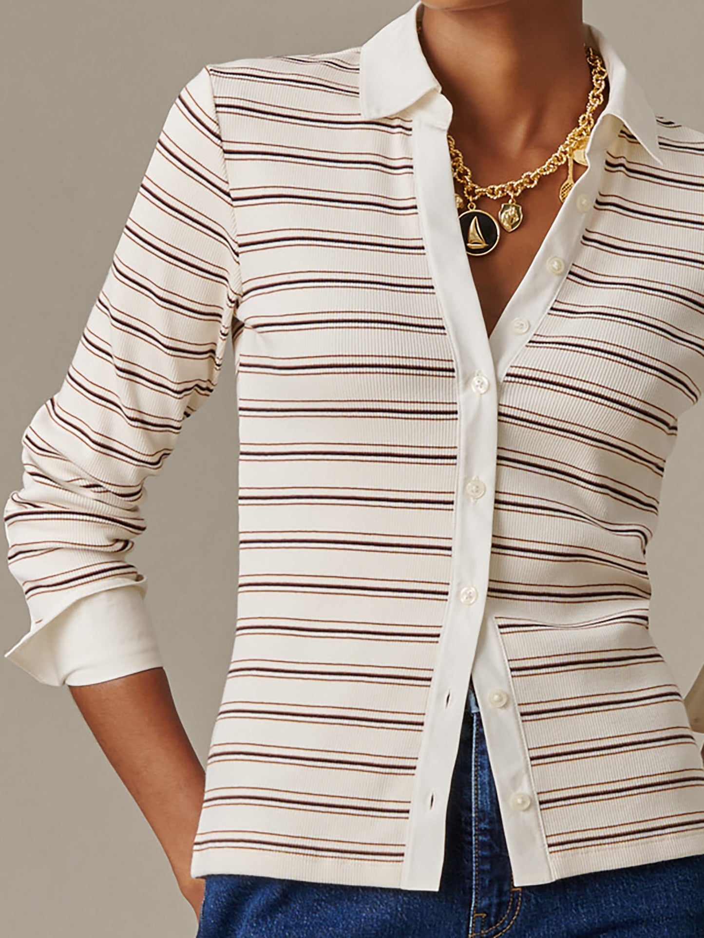 Close-up of a woman wearing Theodora Shirt in Stripe by J.McLaughlin, a classic striped shirt with a crisp white collar and cuffs paired with a gold chain necklace.