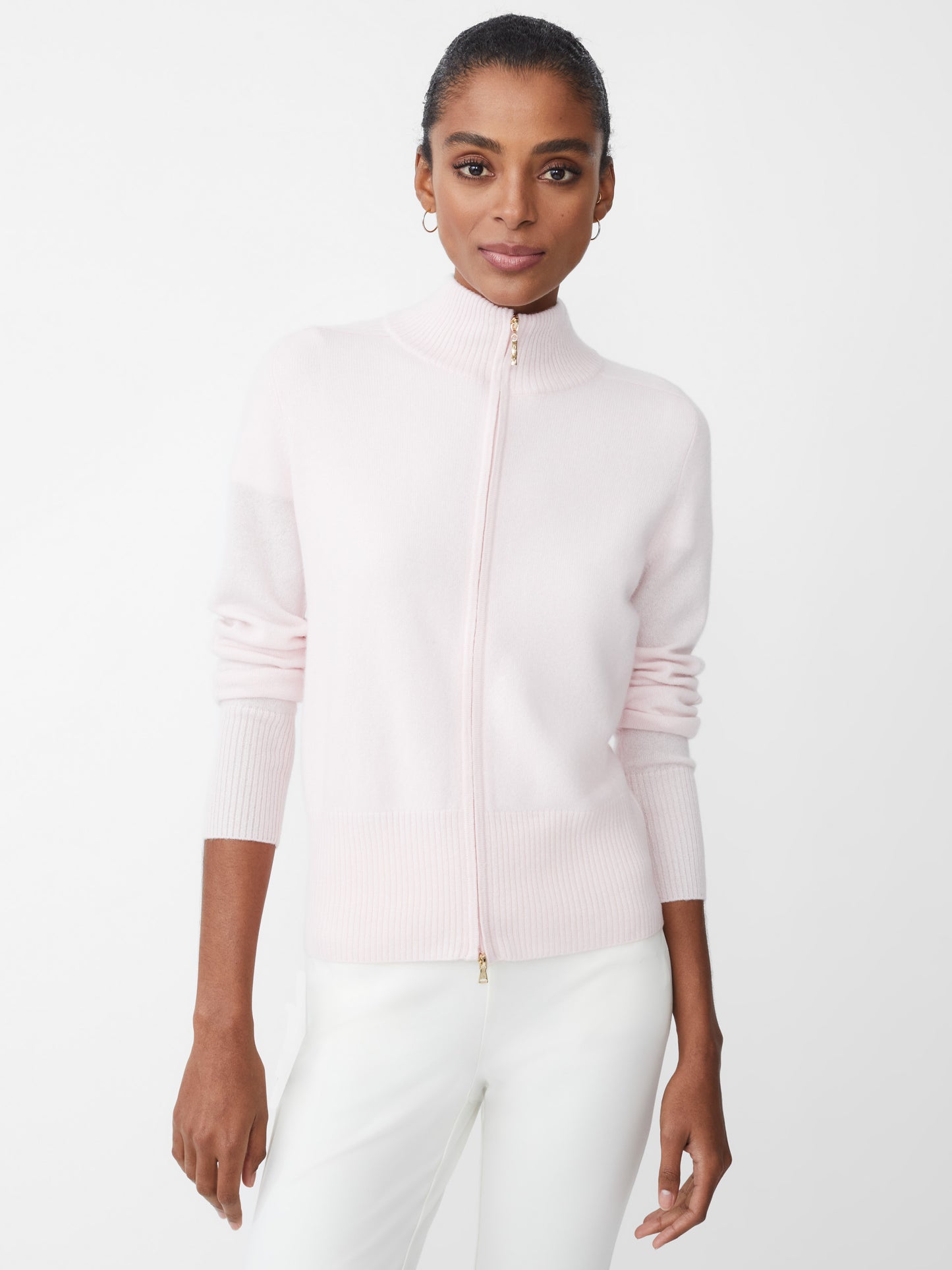 Model wearing J.McLaughlin TIlda sweater in icy pink made with cashmere.