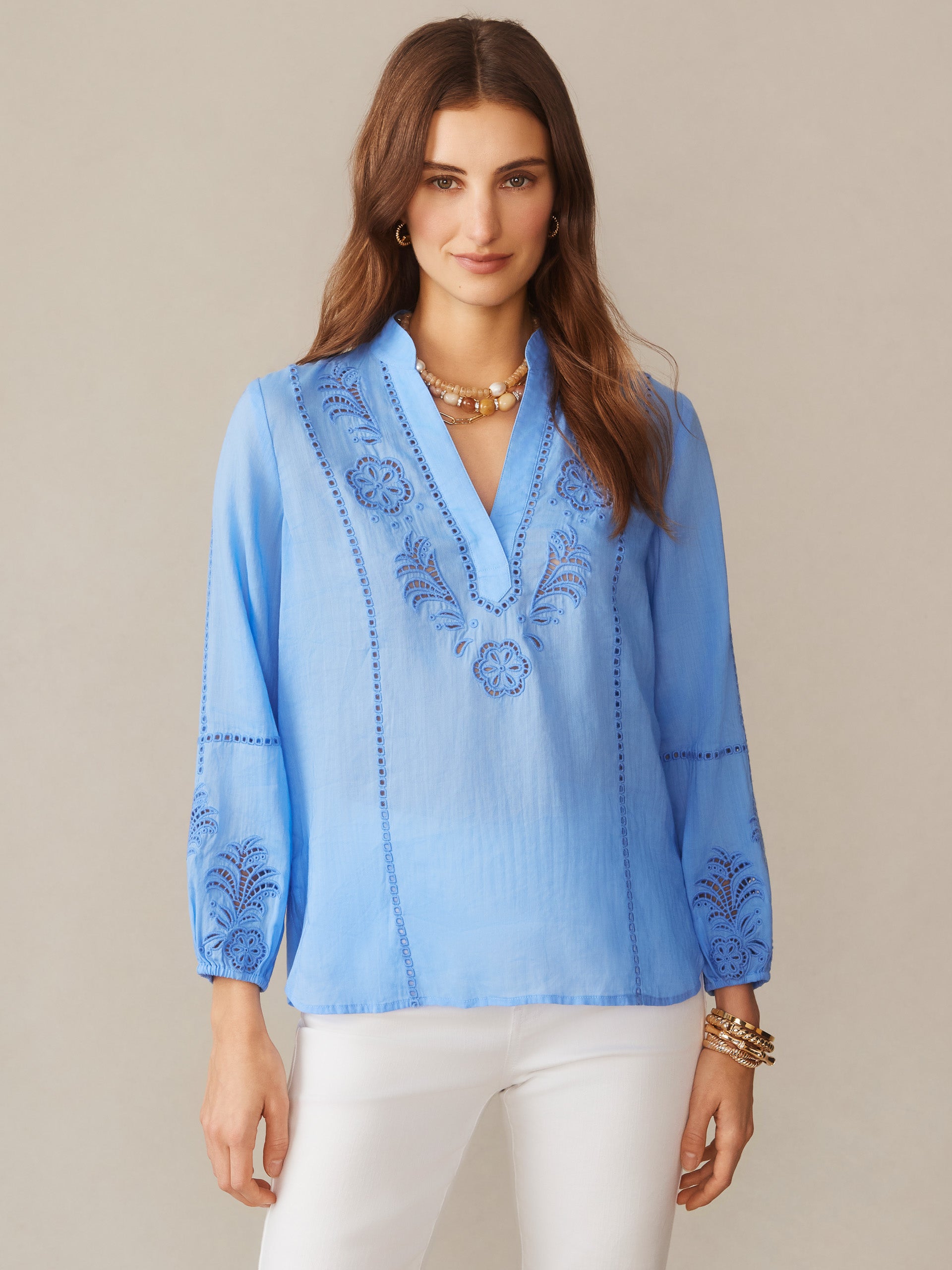 Woman wearing a cornflower blue Varsha Blouse by J.McLaughlin with delicate embroidery, effortlessly stylish and crafted for enduring designs, a destination for defining style. Life, Well-Lived.