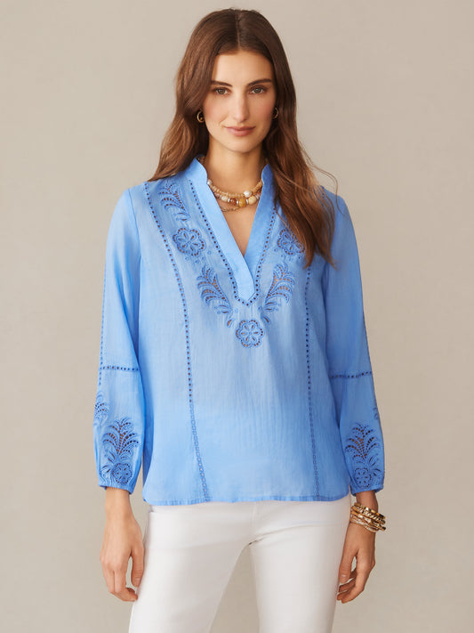 Woman wearing a cornflower blue Varsha Blouse by J.McLaughlin with delicate embroidery, effortlessly stylish and crafted for enduring designs, a destination for defining style. Life, Well-Lived.