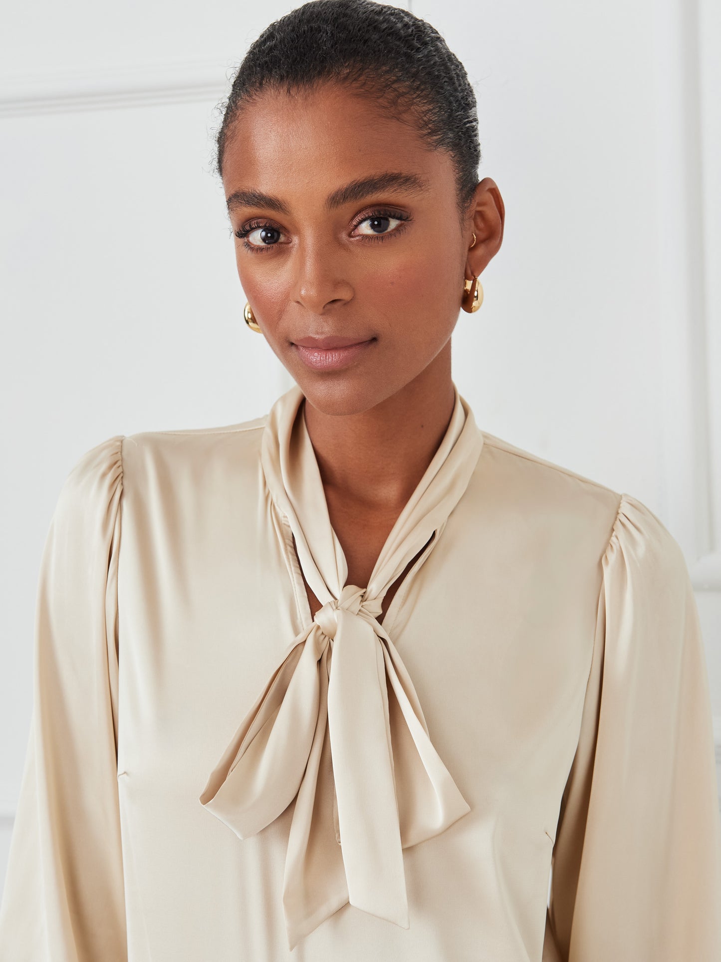 J.McLaughlin Vienna top in champagne made with polyester.