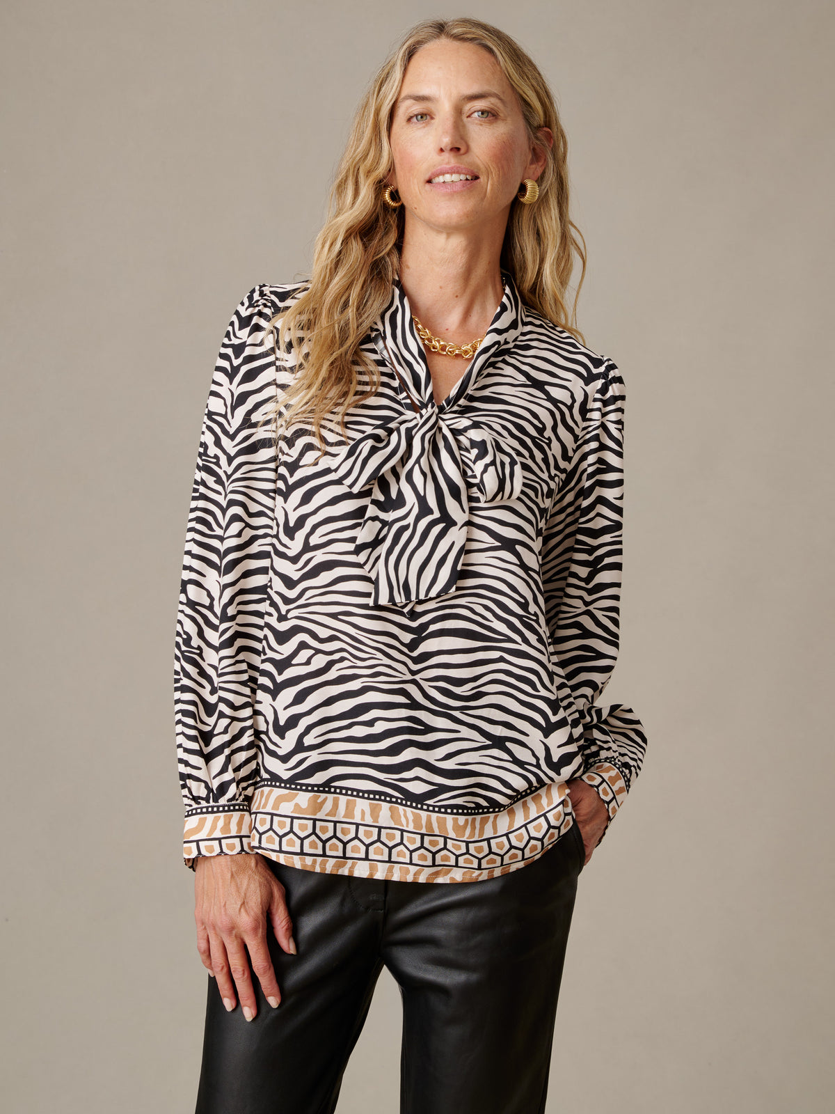 Vienna Silk Blend Blouse in Mini Zebra Medley Stripe shown on a model with a scarf tie neckline soft drape and polished timeless style