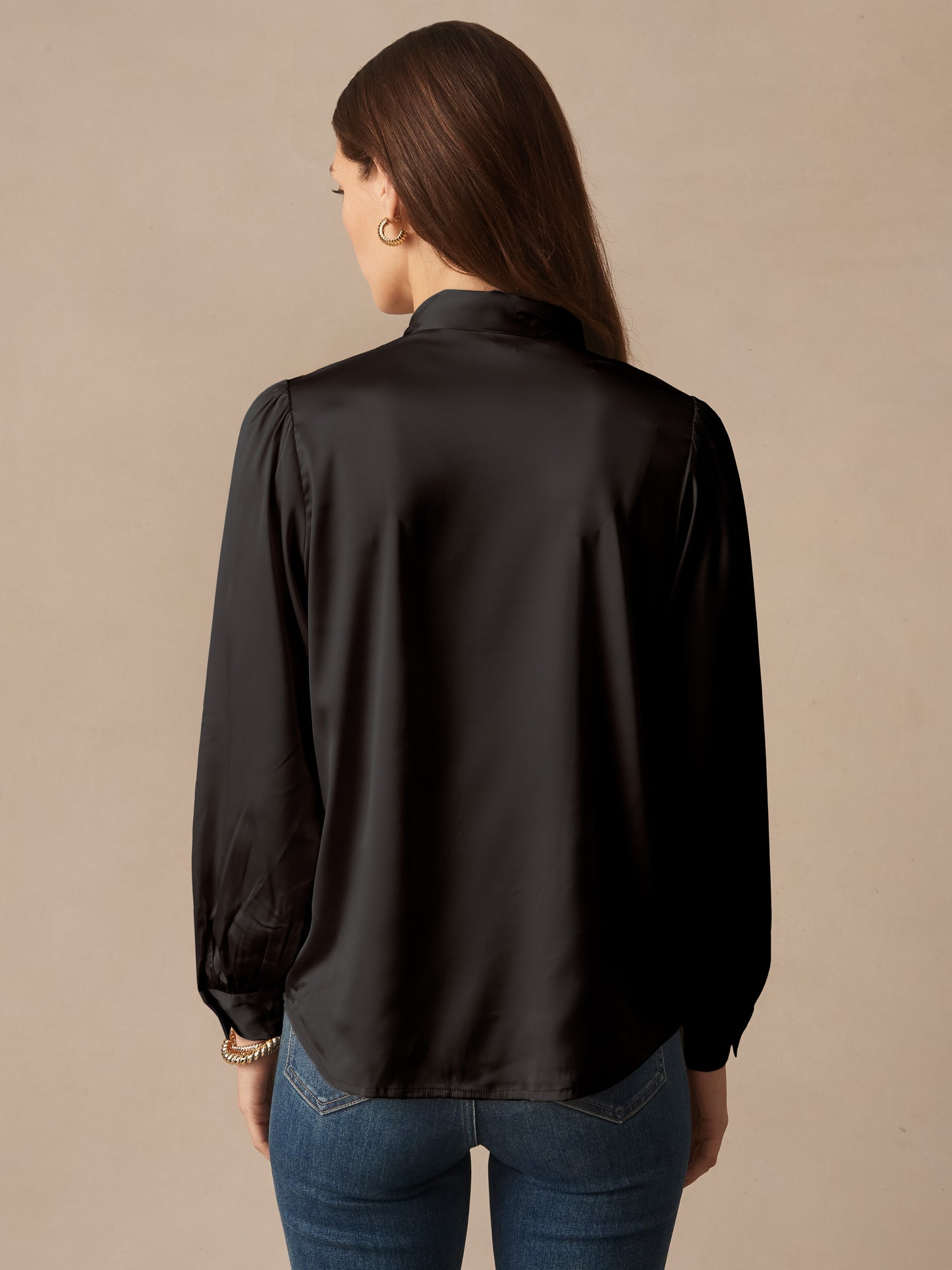 J.McLaughlin Vienna top in black made with stretch satin. 