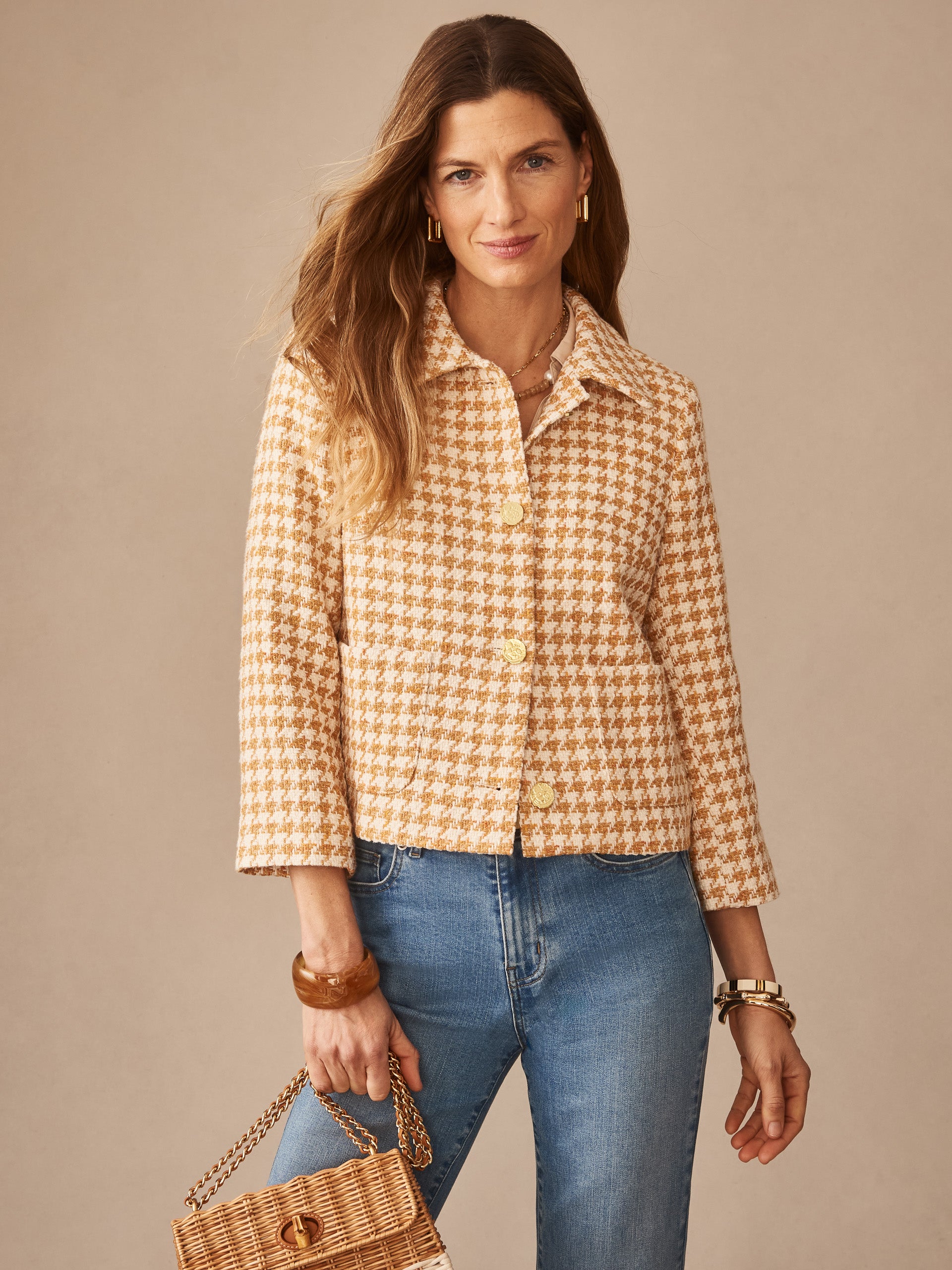 Woman wearing the Violette Tweed Jacket in Houndstooth by J.McLaughlin, paired with jeans and accessories, showcasing effortlessly stylish, enduring designs and innovative fabrics. A destination for defining style. Life, Well-Lived.