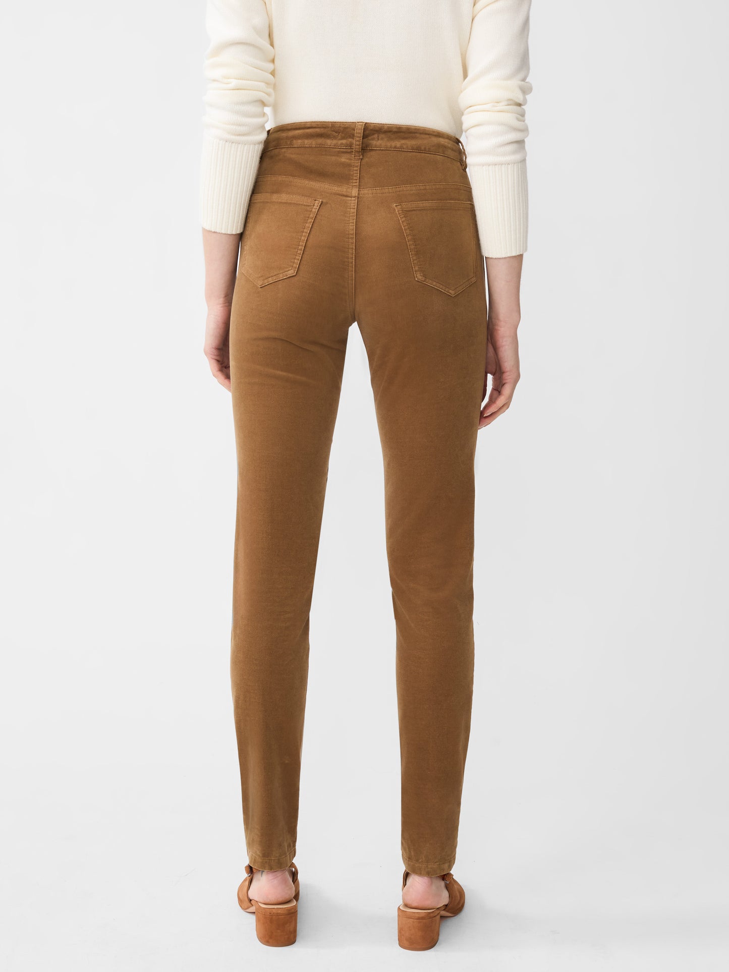 Model wearing J.McLaughlin Watson jeans in camel made with velveteen.