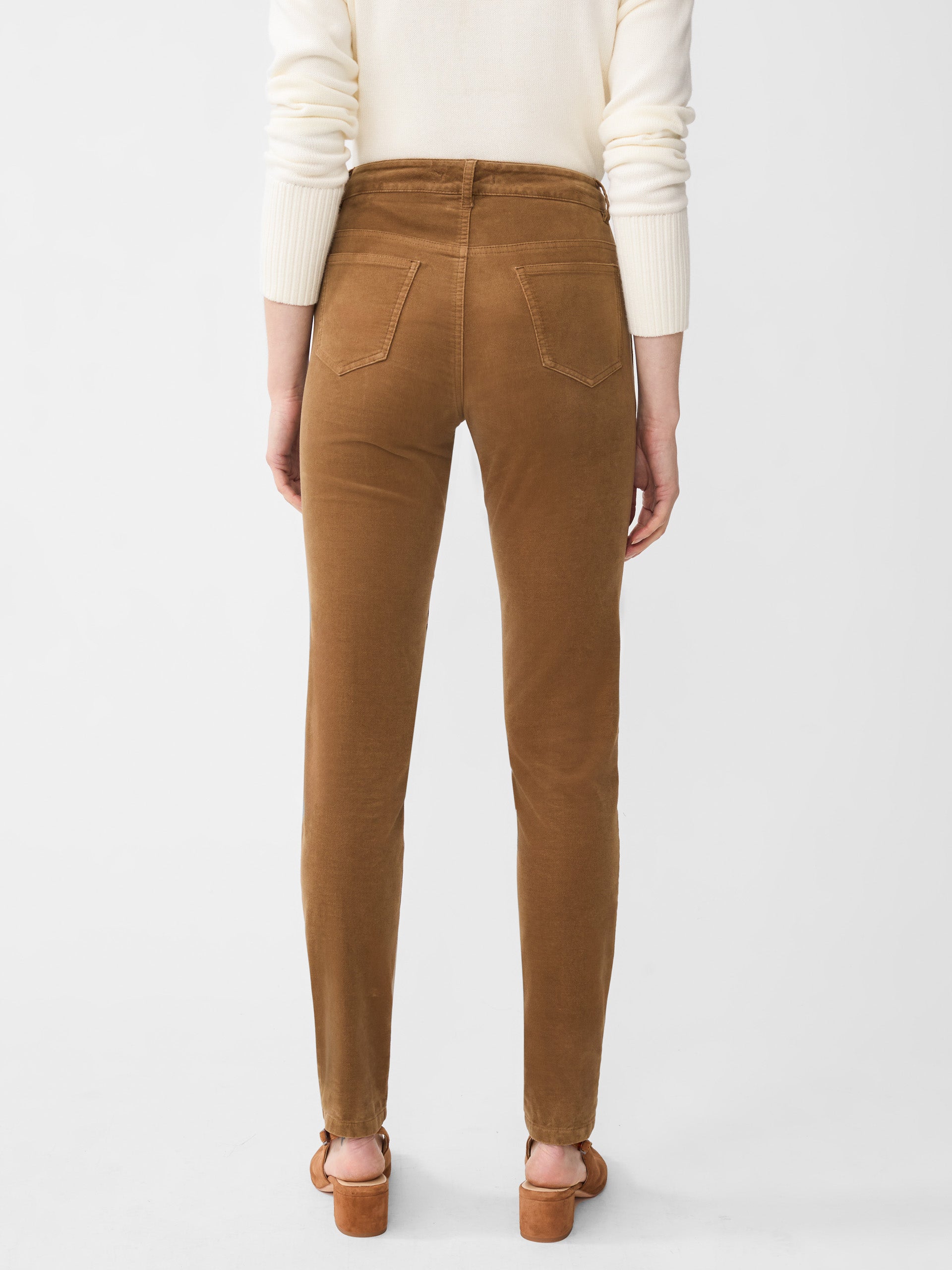 Model wearing J.McLaughlin Watson jeans in camel made with velveteen.