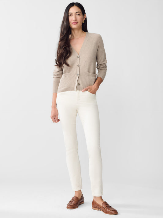 Model wearing J.McLaughlin Watson jeans in egret white made with velveteen.