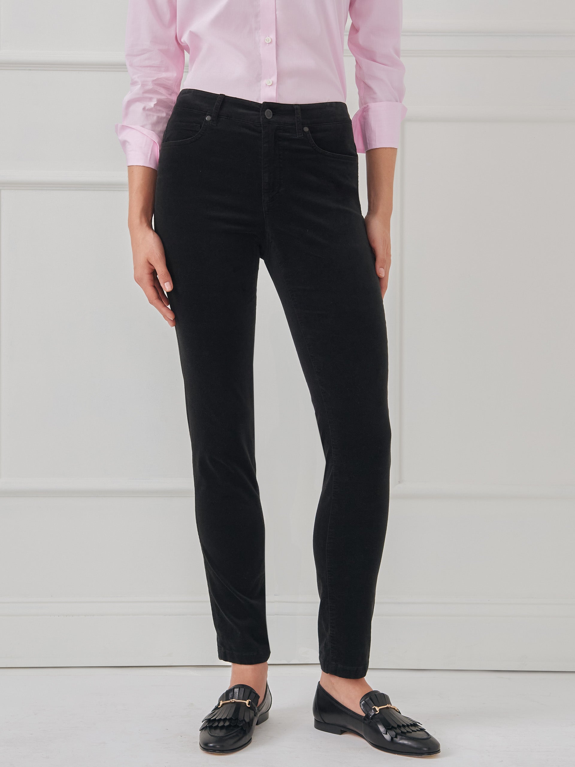 Model wearing J.McLaughlin Watson jeans in black made with velveteen.