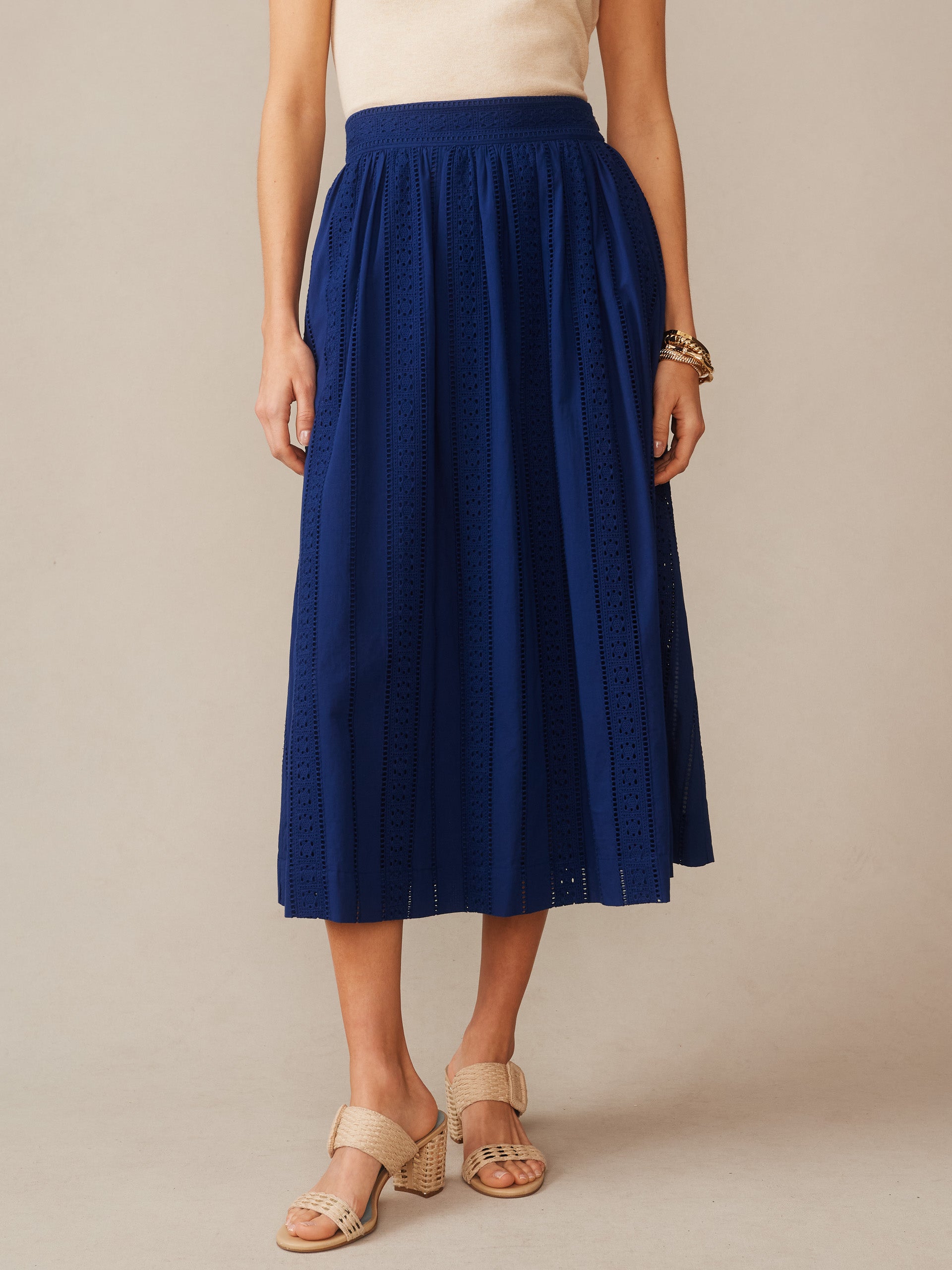 Winnie Skirt in Eyelet by J.McLaughlin showcases effortlessly stylish, enduring designs in rich navy blue eyelet fabric, reflecting innovative fabrics and a legacy of timeless fashion at a destination for defining style. Life, Well-Lived.